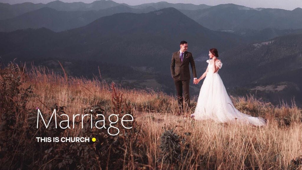 Bride and groom holding hands on a grassy hill with distant mountains and a 'Marriage' text overlay