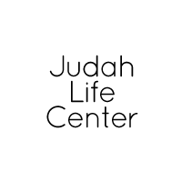 Circular white logo with centred black text reading 'Judah Life Center'