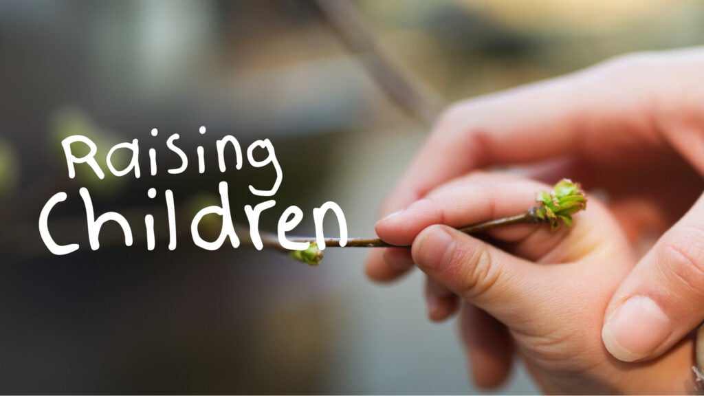 Close-up of adult and child hands holding a small budding twig with overlaid text "Raising Children"