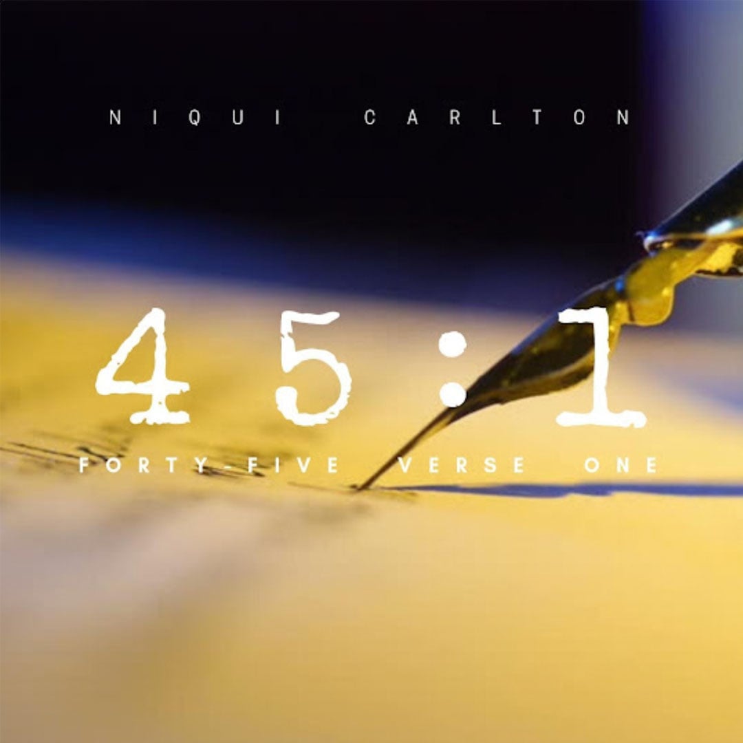 Close-up of a fountain pen nib writing on paper with overlaid text reading "45:1" and "Niqui Carlton"