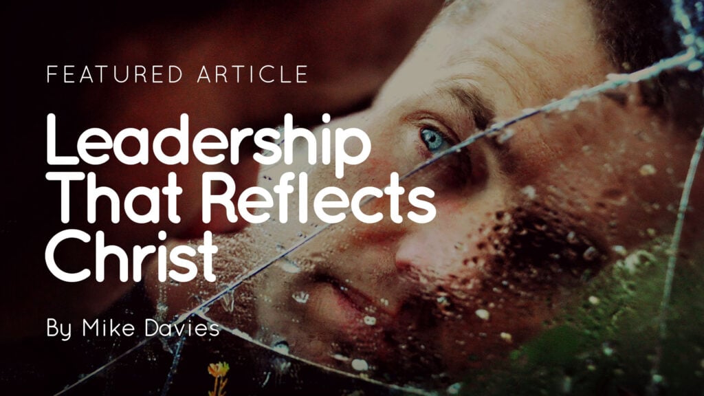 Man's face reflected in cracked wet glass with overlay text 'Leadership That Reflects Christ' by Mike Davies