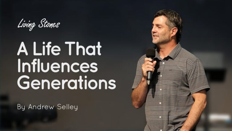 Andrew Selley speaking on stage, holding a microphone with the title text ‘A Life That Influences Generations’ visible