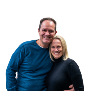 André & Janine van der Merwe standing side by side, smiling and embracing