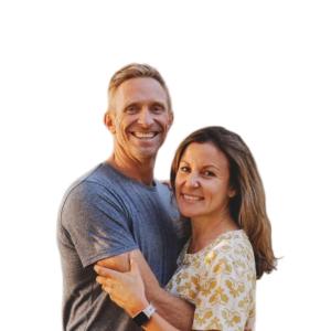 Brad & Angela Verreynne smiling and embracing in a portrait
