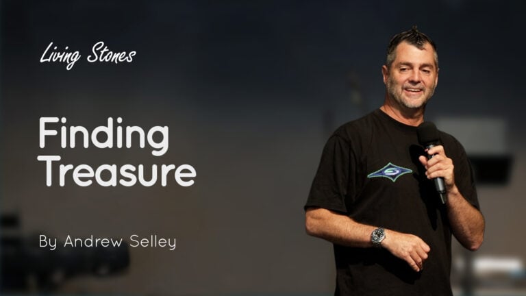 Man on stage holding a microphone, smiling, with overlay text 'Finding Treasure' and 'Living Stones'