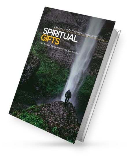 Paperback book cover titled 'SPIRITUAL GIFTS' by Stephan van Zyl & Nadene Badenhorst, showing a person standing on rocks by a