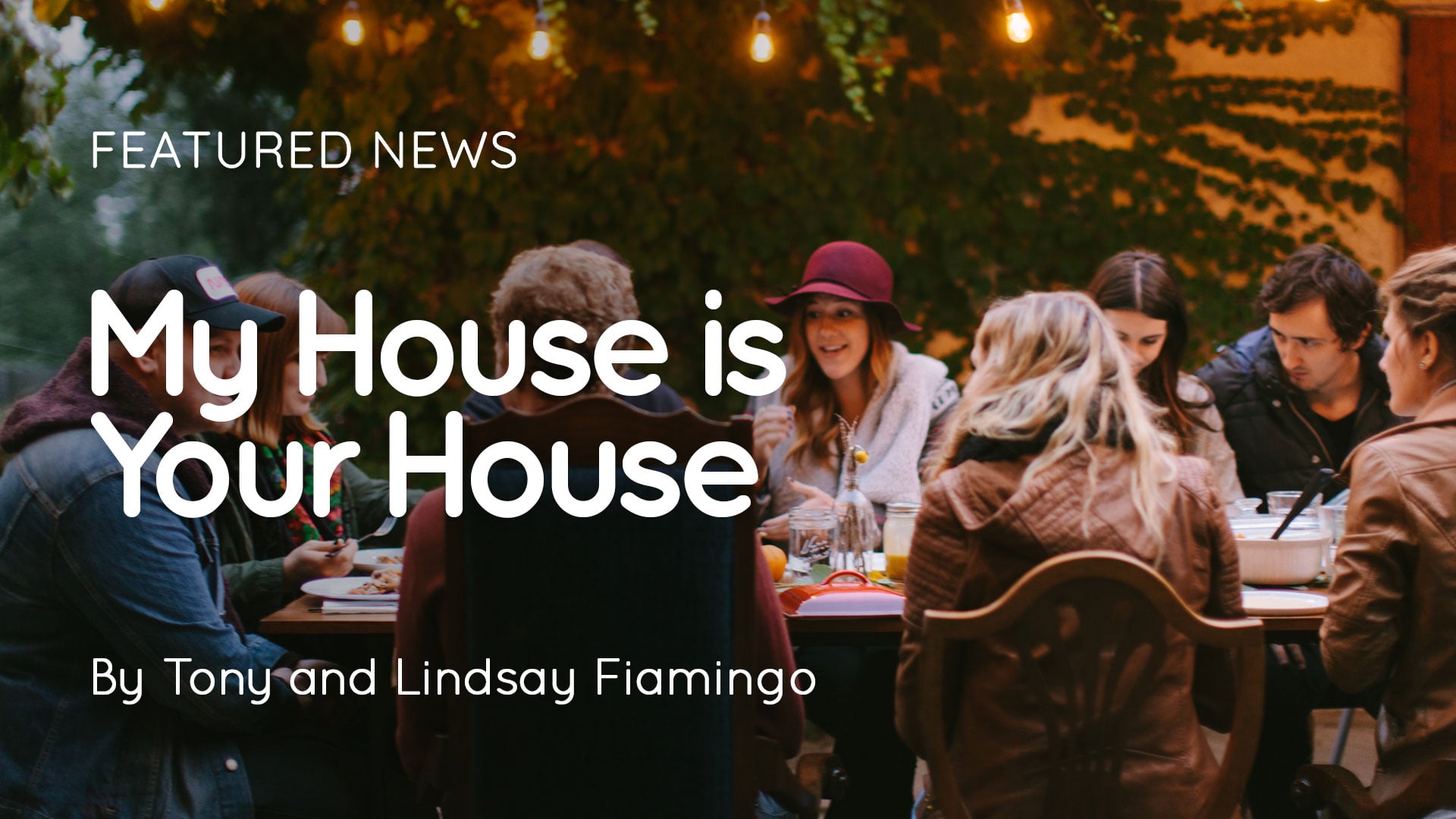 Group of people dining outdoors at a long table under string lights; article by Tony and Lindsay Fiamingo