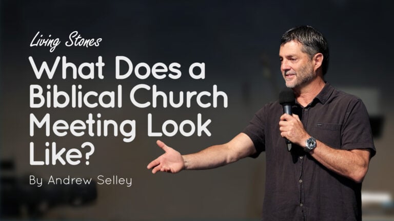 Speaker Andrew Selley holding a microphone and gesturing during a talk with title text to left