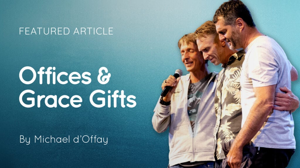 Three men with arms round each other, one holding a microphone, beside text 'Offices & Grace Gifts' and author credit Michael