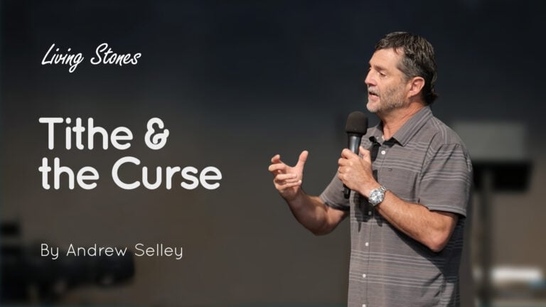 Speaker Andrew Selley holding a microphone beside graphic text 'Tithe & the Curse' on a dark stage