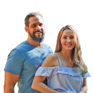 Portrait of Gerrit Loots and his wife Cherie: man with beard in a blue t-shirt and woman in a striped off-shoulder top, both