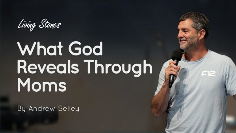 Speaker holding a microphone at right with slide text “What God Reveals Through Moms” and “By Andrew Selley”