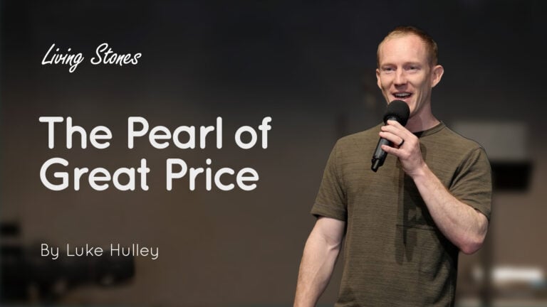 Speaker Luke Hulley holding a microphone on stage beside text reading 'The Pearl of Great Price'